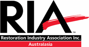 Logo of RIA, Restoration Industry Association Inc. It features bold black letters "RIA" with a red brushstroke under the "A." Below, it reads "Restoration Industry Association Inc." and "Australasia" in a red bar.